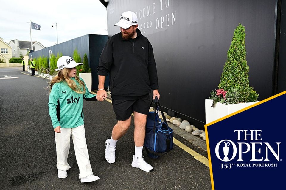 Shane Lowry arrives at the course with his daughter Iris on Thursday morning